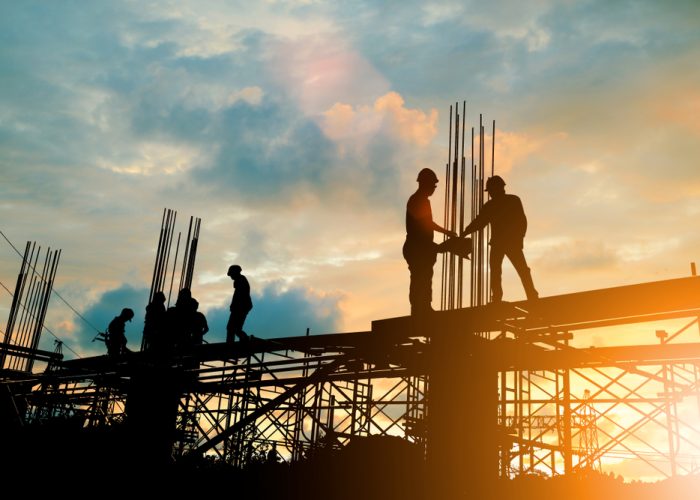 Silhouette,Of,Engineer,And,Construction,Team,Working,At,Site,Over